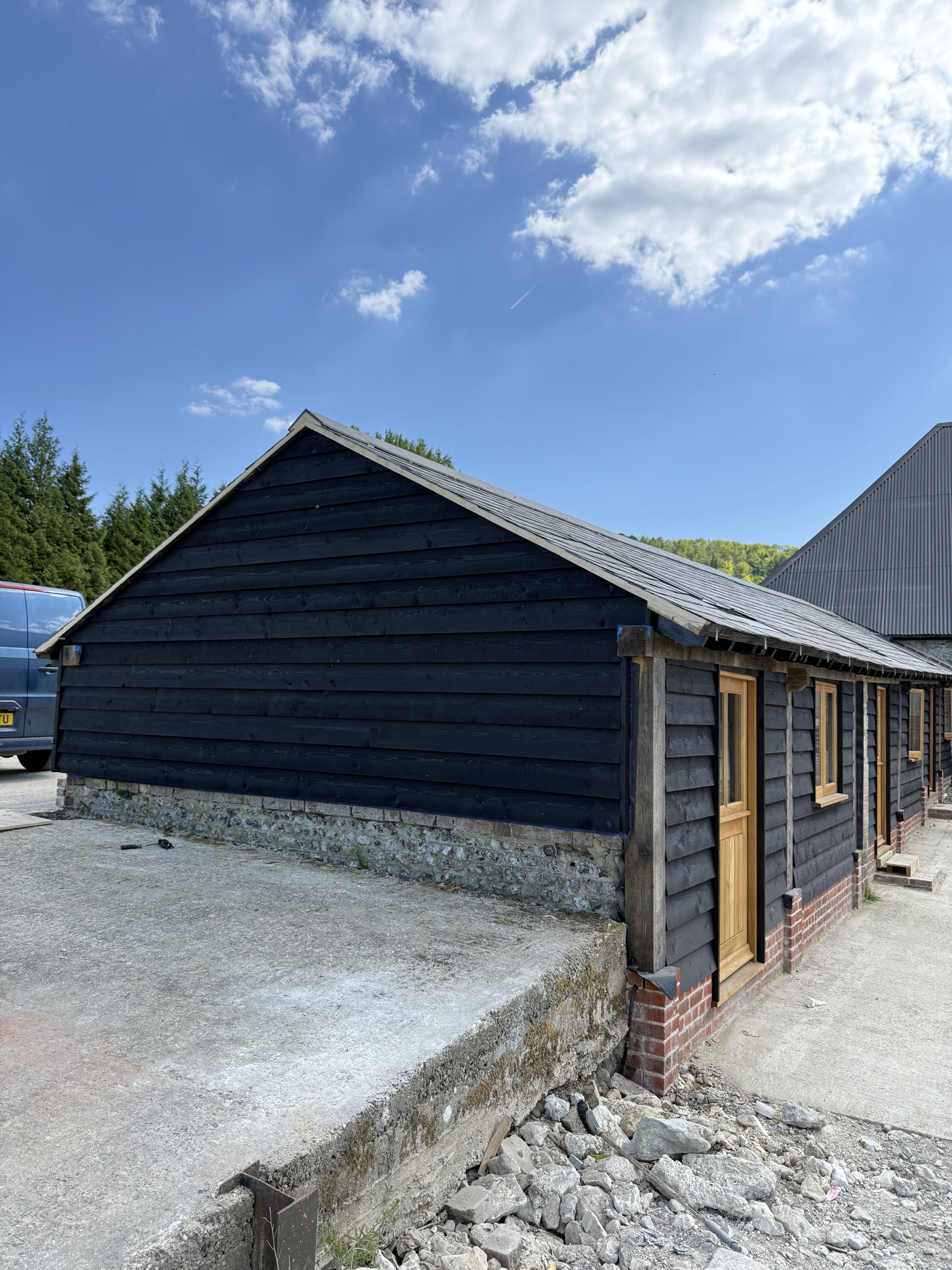 Horizontal dark timber cladding across the gable end